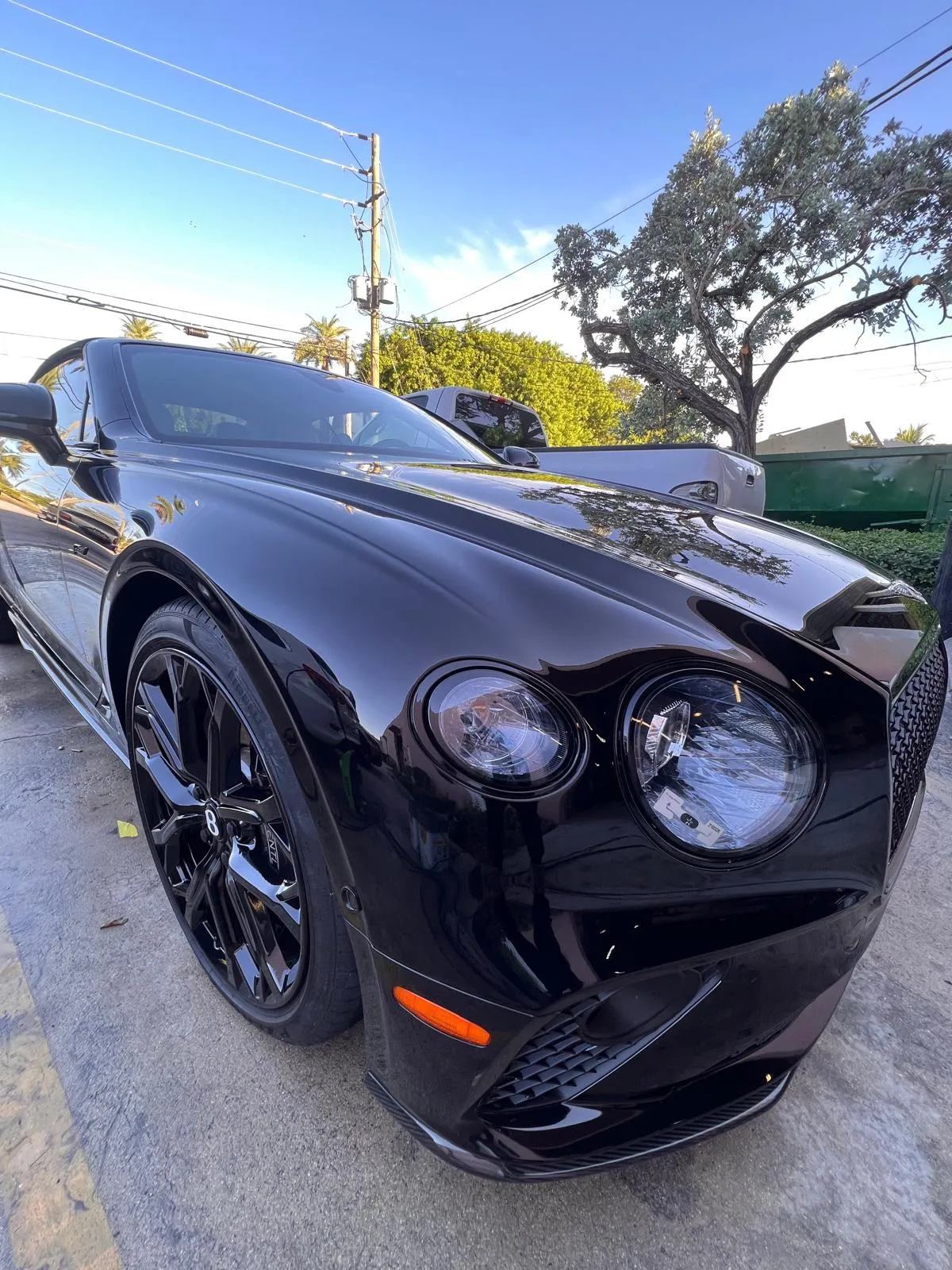 Front detail of a black Bentley Continental GT after paint work at Craft Collision