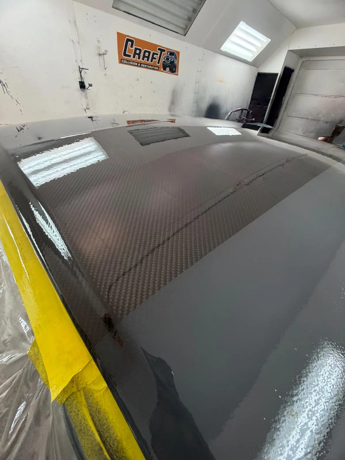Carbon fiber roof panel blended into the surrounding paint on a custom build