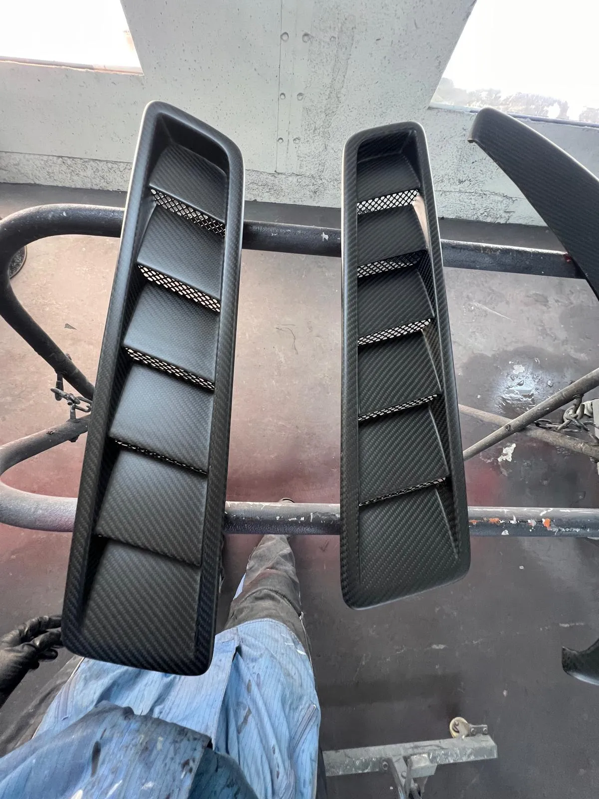 Pair of carbon fiber side vent panels fabricated at Craft Collision