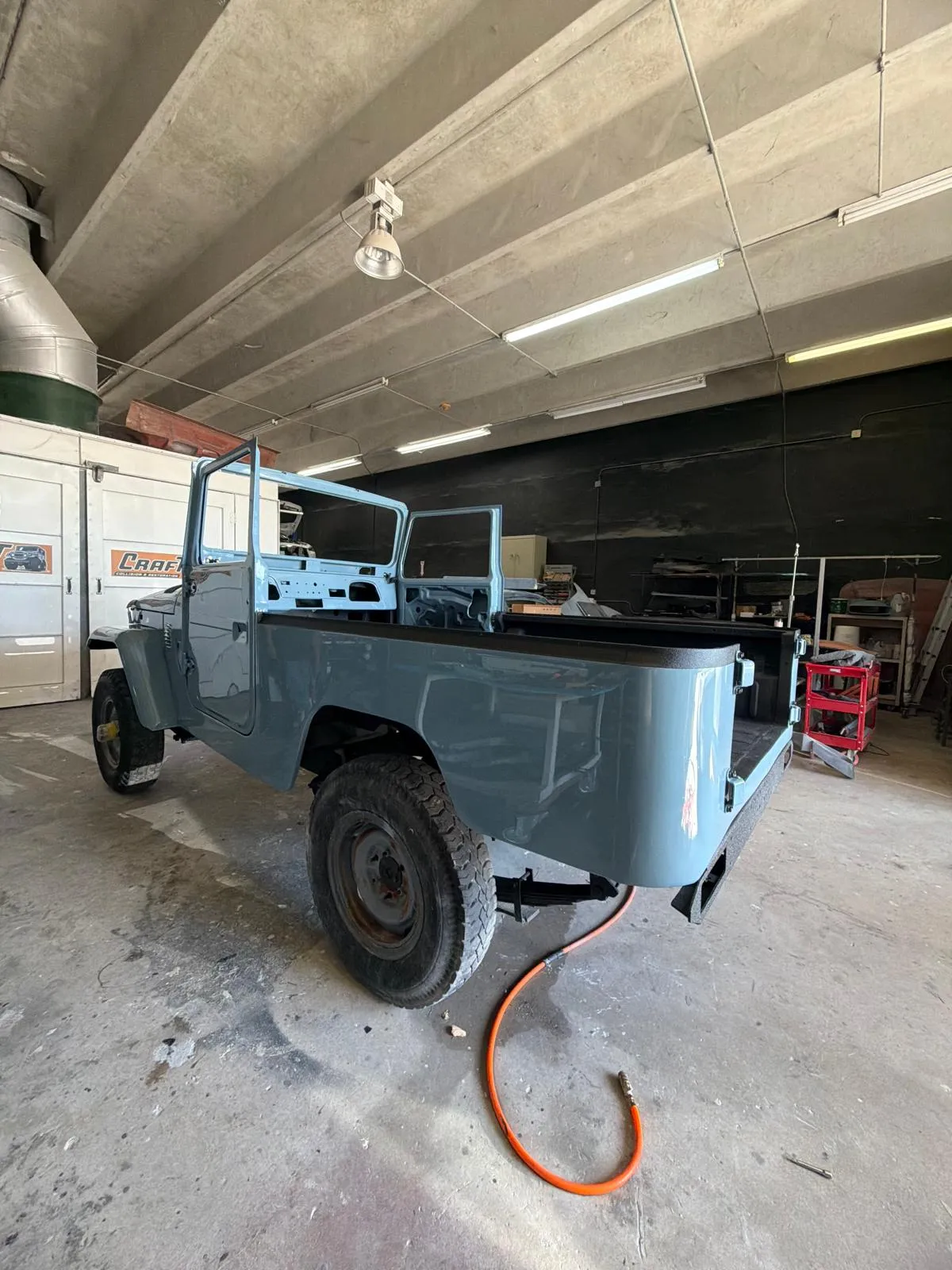 Restored Toyota Land Cruiser FJ40 assembled in the Craft Collision shop