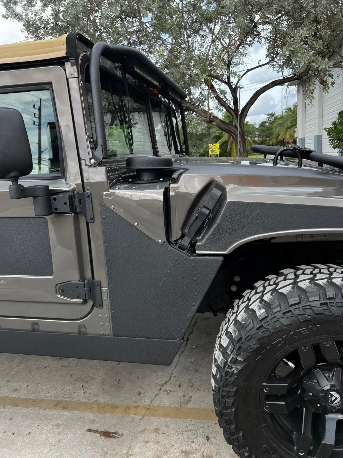 Hummer H1 outside the shop after a custom respray at Craft Collision